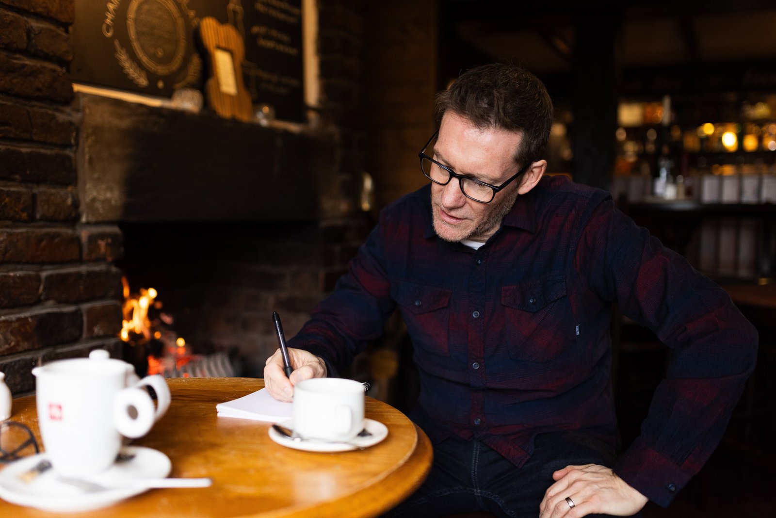 Garry taking notes in a pub