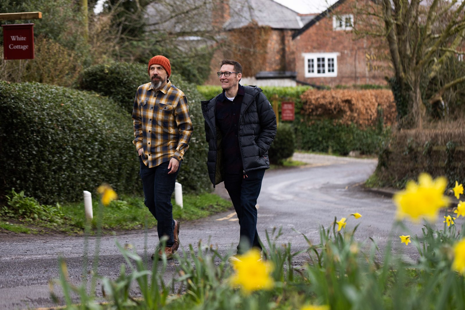 James and Garry walking by daffodils